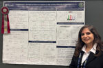 Hoda Shokrollahzadeh Behbahani in front of her poster